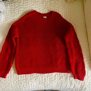 Girl’s red knit sweater